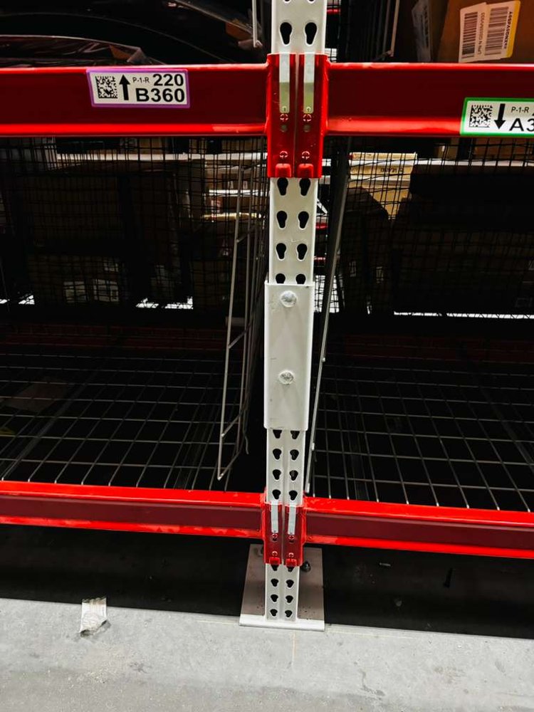 Close-up of a beam-to-upright connection point on pallet rack