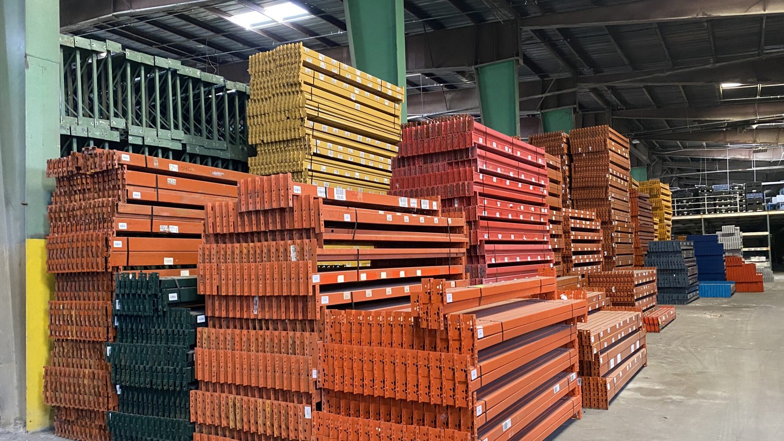 Used pallet rack and beams staged in the AMH yard, ready for central Arkansas projects