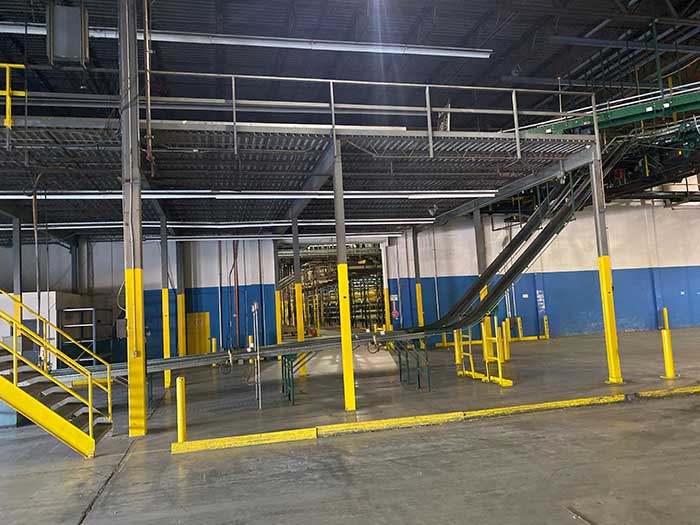 Installed warehouse mezzanine with stairs and safety gate