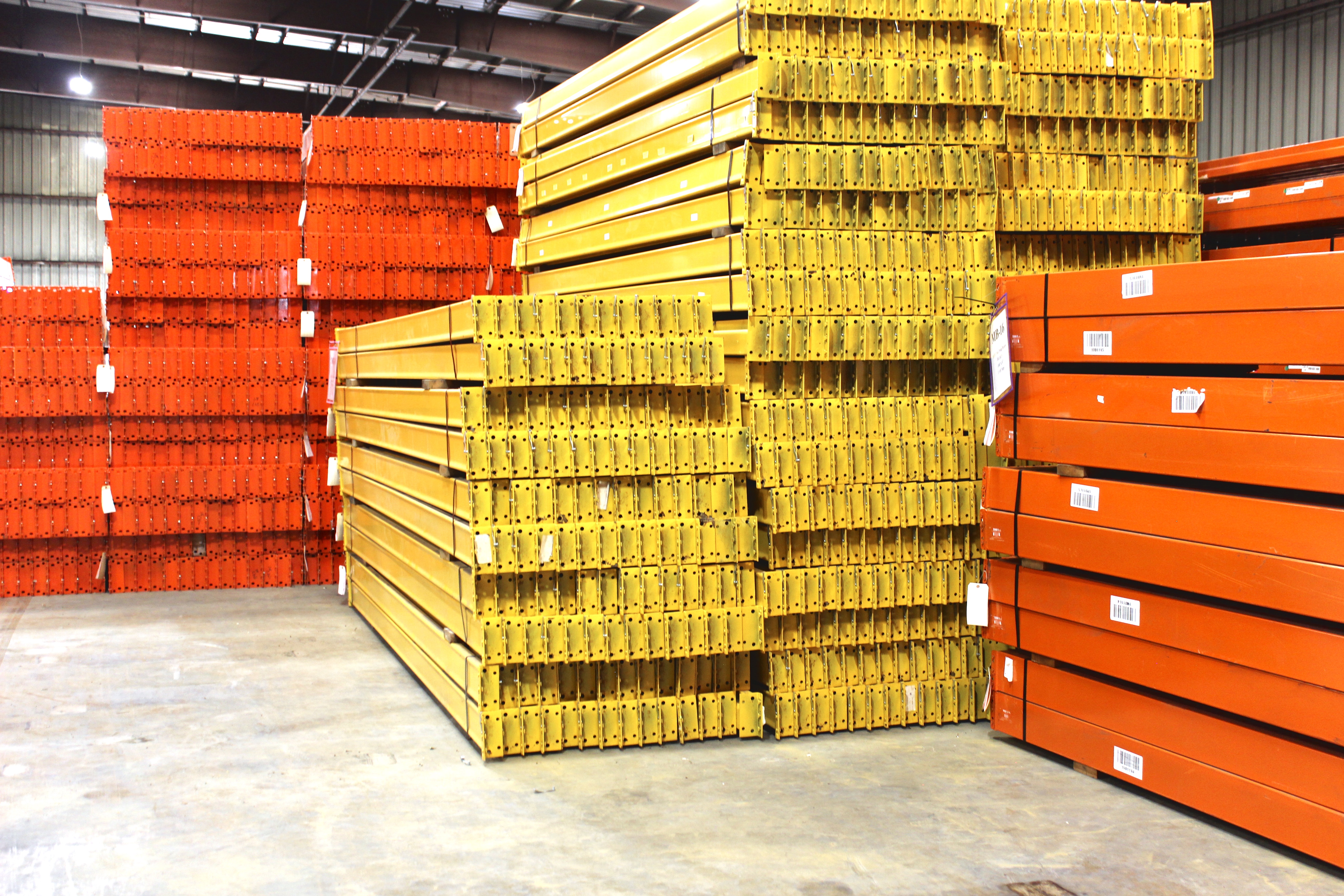 Sorted used pallet rack inventory in the AMH yard, cleaned and staged to reenter service